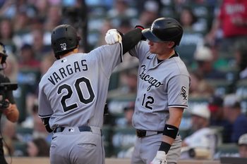 Jun 1, 2026; Minneapolis, Minnesota, USA; Chicago White Sox third baseman Miguel Vargas (20) celebrates with shortstop Colson Montgomery (12) after hitting a two run home run during the fifth inning against the Minnesota Twins at Target Field. Mandatory Credit: Jordan Johnson-Imagn Images