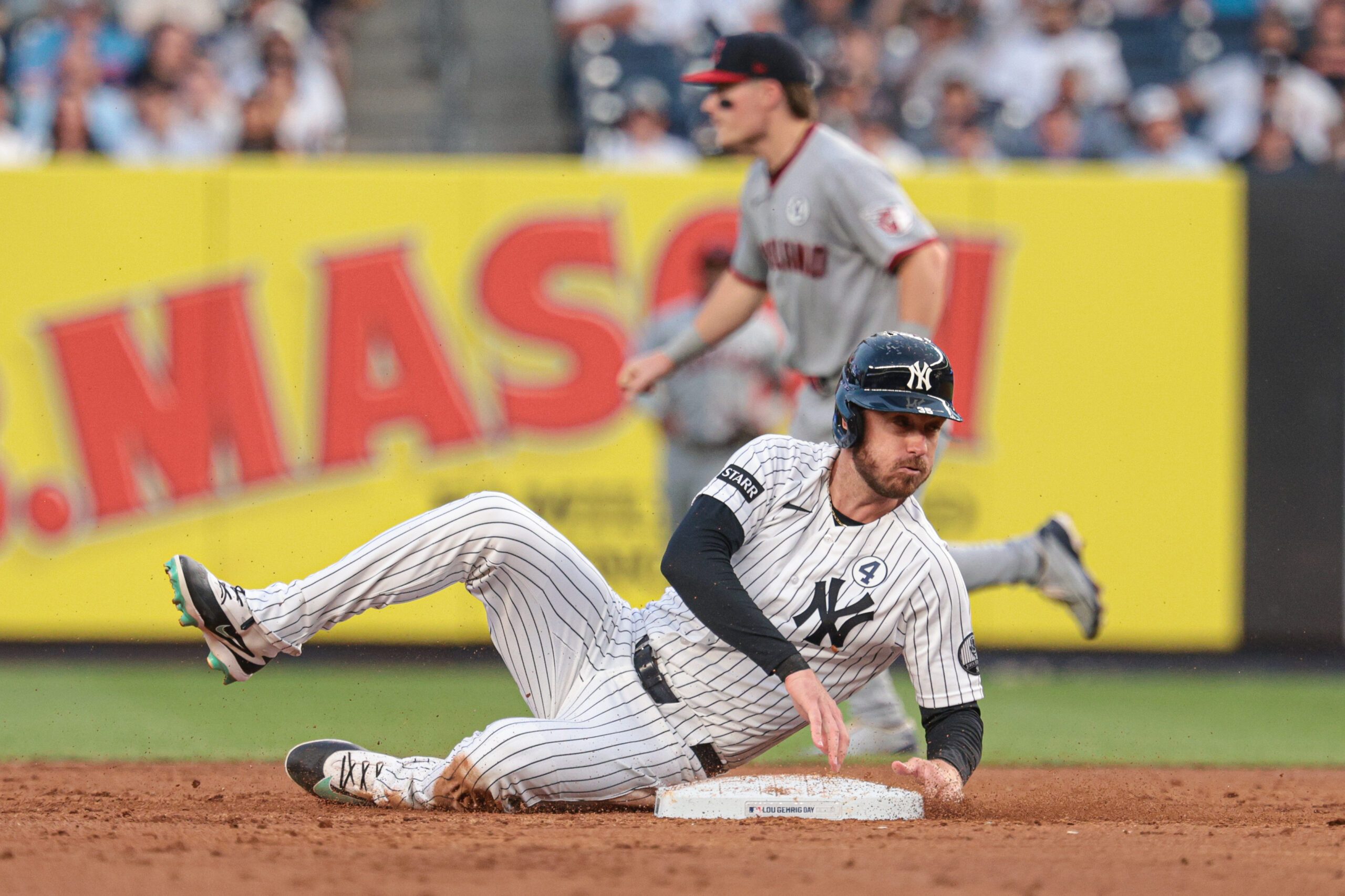 Jun 2, 2026; Bronx, New York, USA; New York Yankees left fielder Cody Bellinger (35) slides in to second base during the third inning against the Cleveland Guardians at Yankee Stadium. Mandatory Credit: Vincent Carchietta-Imagn Images