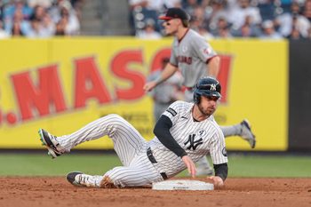 Jun 2, 2026; Bronx, New York, USA; New York Yankees left fielder Cody Bellinger (35) slides in to second base during the third inning against the Cleveland Guardians at Yankee Stadium. Mandatory Credit: Vincent Carchietta-Imagn Images