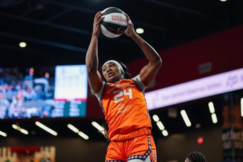 Jun 2, 2026; College Park, Georgia, USA; Connecticut Sun forward Aneesah Morrow (24) grabs a rebound against the Atlanta Dream in the first quarter at Gateway Center Arena at College Park. Mandatory Credit: Brett Davis-Imagn Images