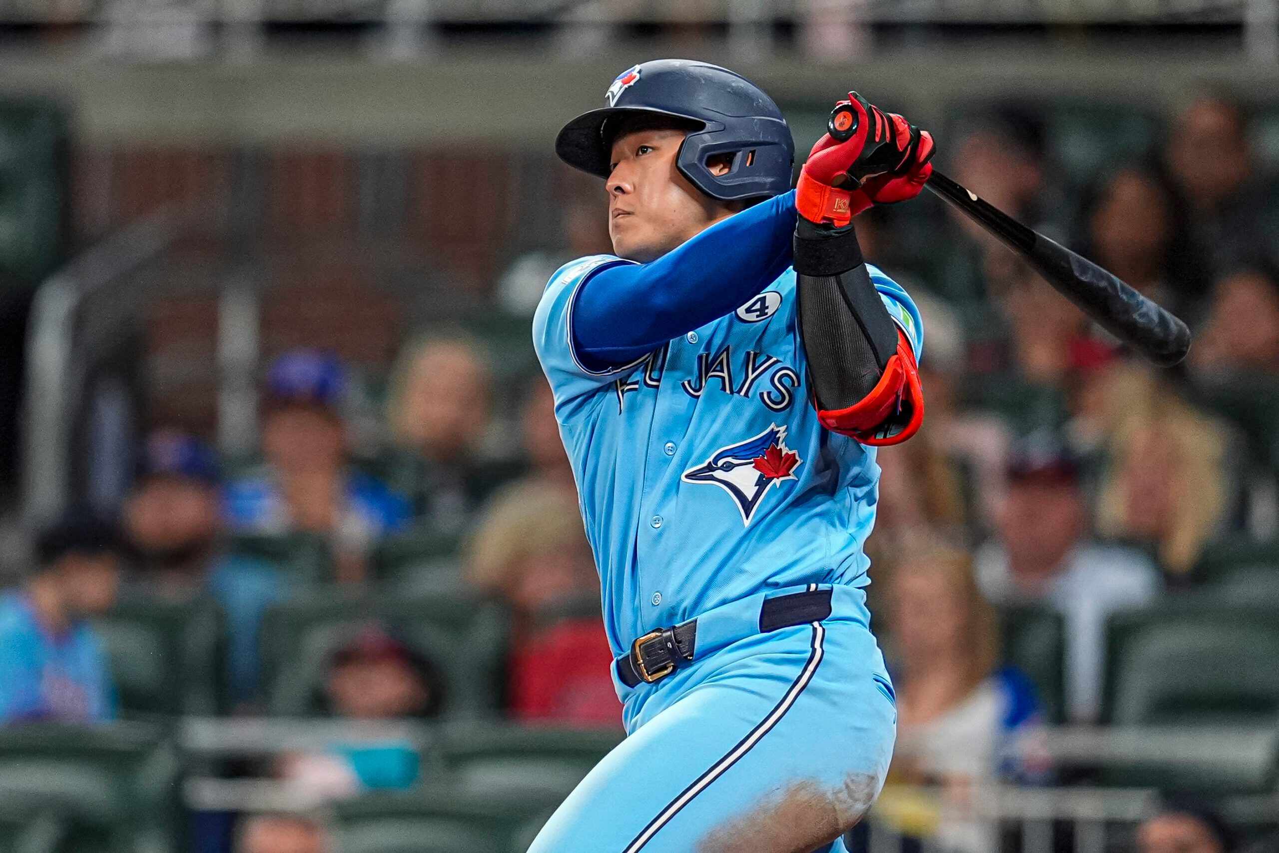 Jun 2, 2026; Cumberland, Georgia, USA; Toronto Blue Jays third baseman Kazuma Okamoto (7) hits a single against the Atlanta Braves during the ninth inning at Truist Park. Mandatory Credit: Dale Zanine-Imagn Images