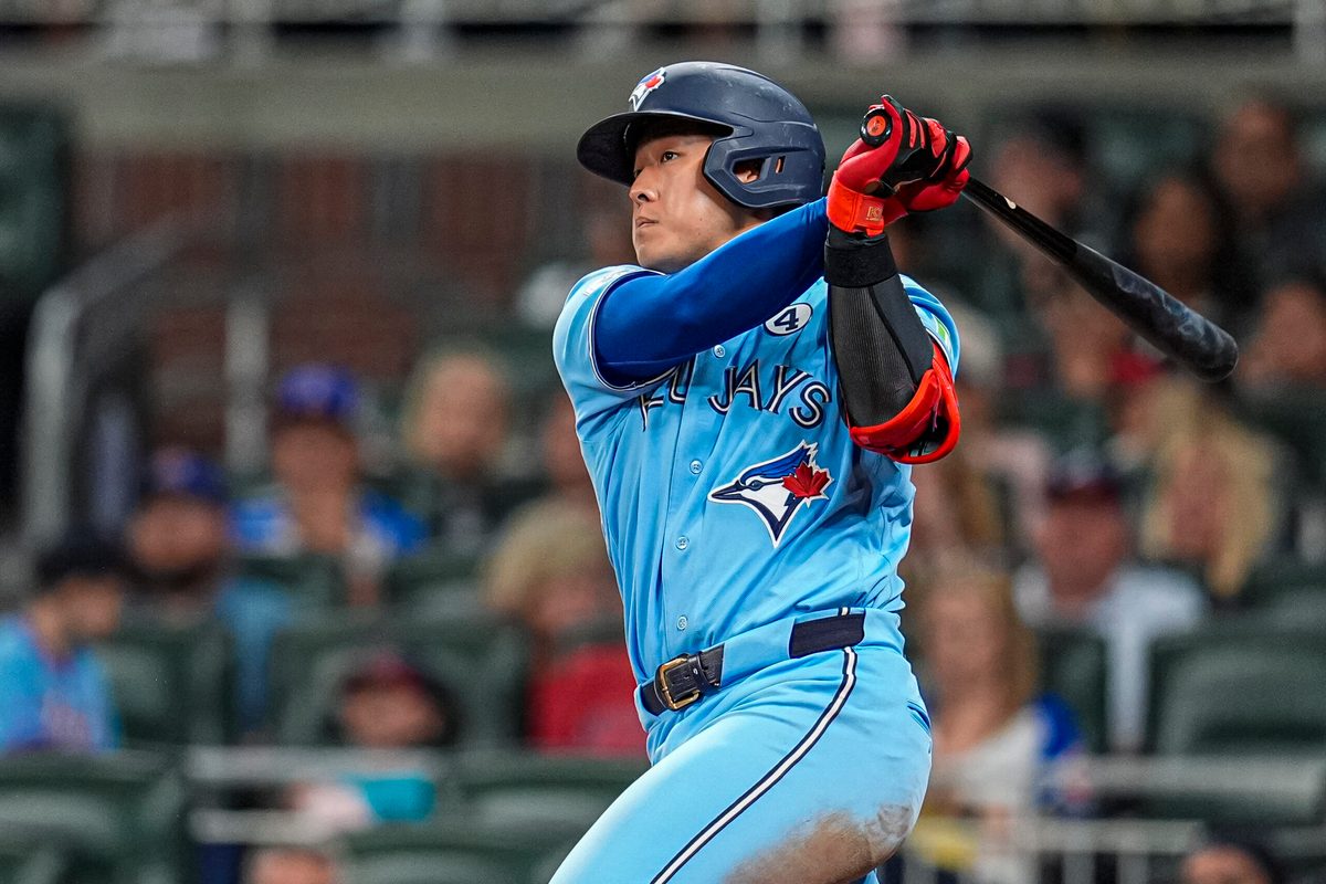 Jun 2, 2026; Cumberland, Georgia, USA; Toronto Blue Jays third baseman Kazuma Okamoto (7) hits a single against the Atlanta Braves during the ninth inning at Truist Park. Mandatory Credit: Dale Zanine-Imagn Images