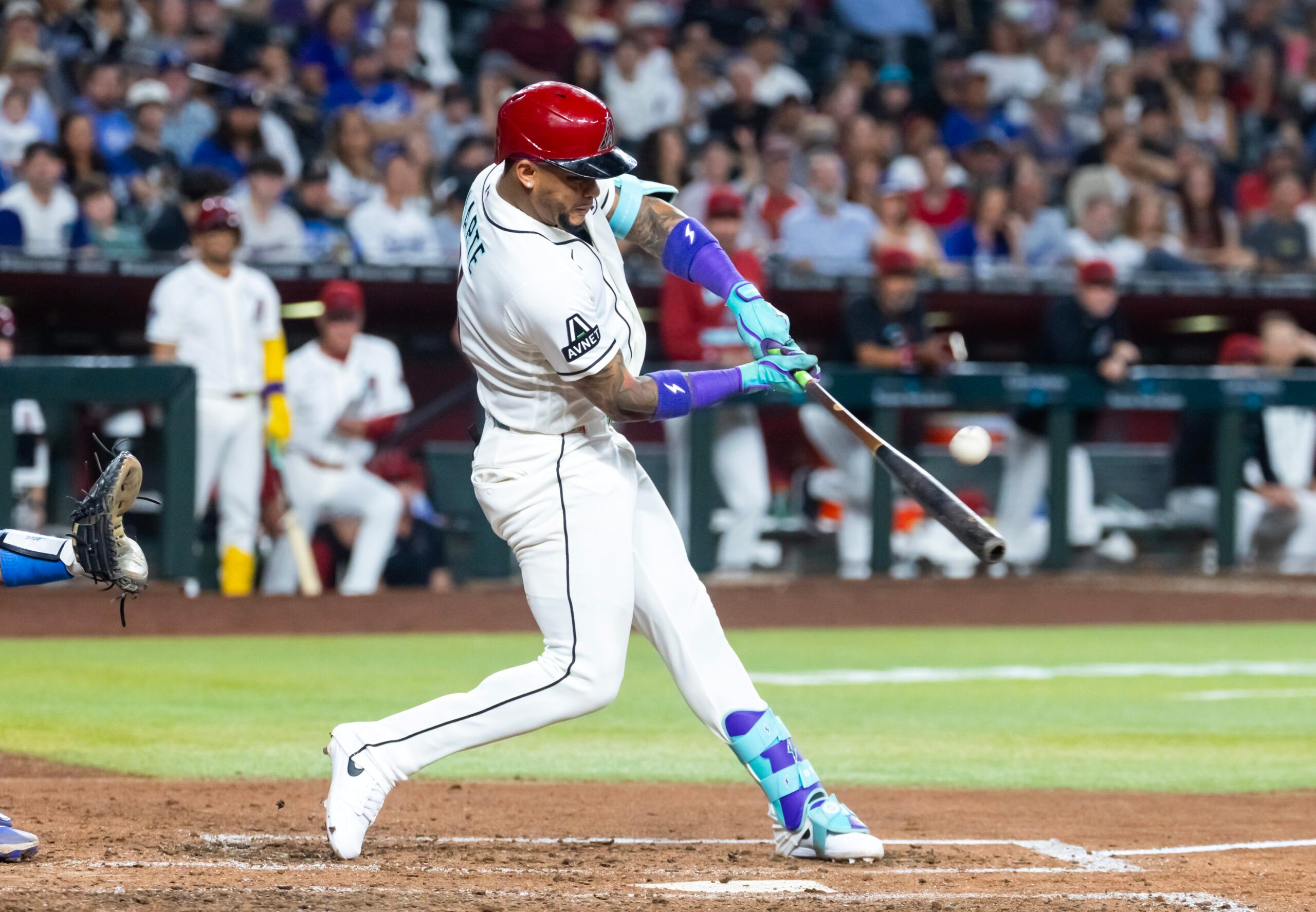 Jun 2, 2026; Phoenix, Arizona, USA; Arizona Diamondbacks second baseman Ketel Marte hits a sacrifice fly to drive in a run in the fifth inning against the Los Angeles Dodgers at Chase Field. Mandatory Credit: Mark J. Rebilas-Imagn Images