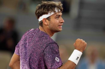 Jun 3, 2026; Paris, France; Flavio Cobolli of Italy reacts during his match against Felix Auger-Aliassime of Canada on day 11 at Stade Roland Garros. Mandatory Credit: Susan Mullane-Imagn Images