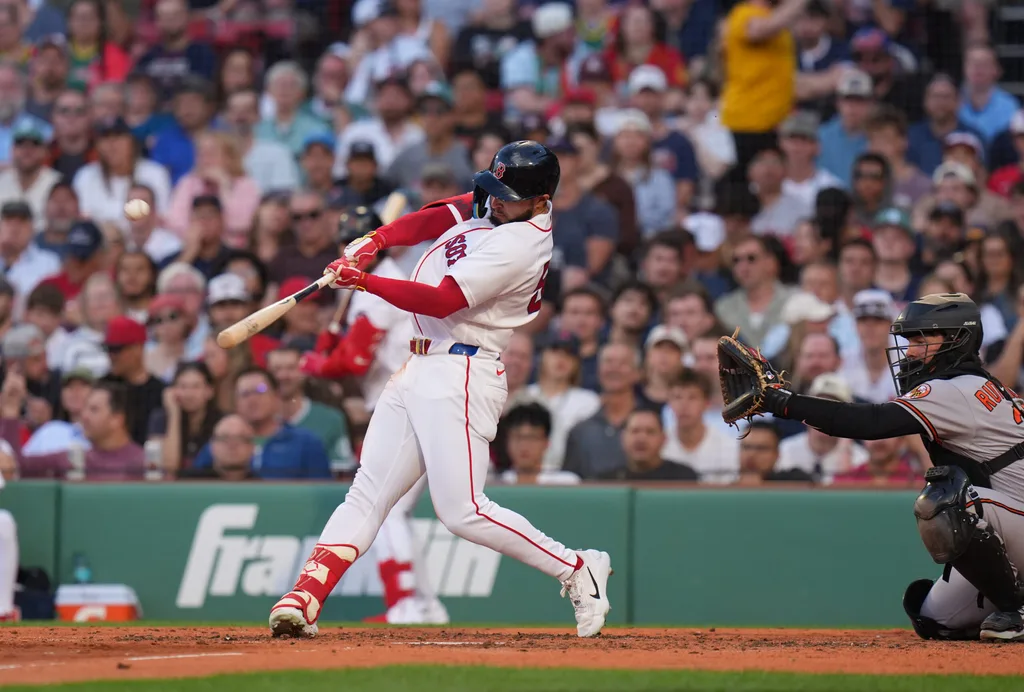 Jun 3, 2026; Boston, Massachusetts, USA; Boston Red Sox right fielder Wilyer Abreu (52) hits a two run home run against the Baltimore Orioles in the third inning at Fenway Park. Mandatory Credit: David Butler II-Imagn Images