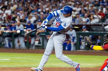 Jun 3, 2026; Phoenix, Arizona, USA; Los Angeles Dodgers designated hitter Shohei Ohtani hits a single in the fifth inning against the Arizona Diamondbacks at Chase Field. Mandatory Credit: Mark J. Rebilas-Imagn Images