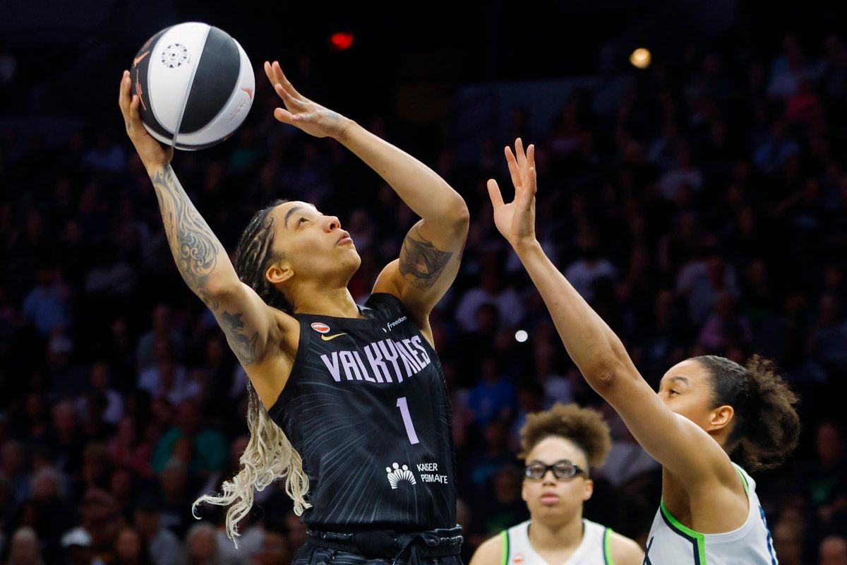 Jun 4, 2026; Minneapolis, Minnesota, USA; Golden State Valkyries forward Gabby Williams (1) shoots the ball against  Minnesota Lynx forward Nia Coffey (12) in the first quarter at Target Center. Mandatory Credit: Bruce Kluckhohn-Imagn Images
