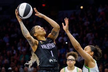 Jun 4, 2026; Minneapolis, Minnesota, USA; Golden State Valkyries forward Gabby Williams (1) shoots the ball against  Minnesota Lynx forward Nia Coffey (12) in the first quarter at Target Center. Mandatory Credit: Bruce Kluckhohn-Imagn Images