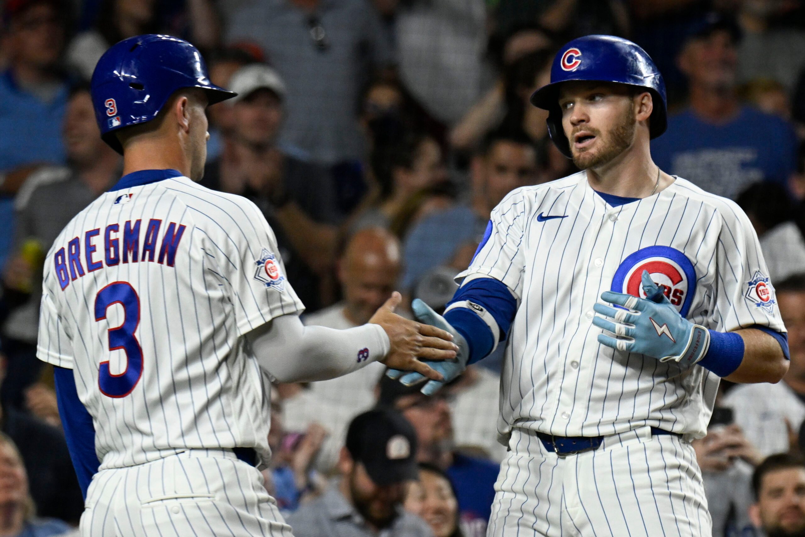 Jun 4, 2026; Chicago, Illinois, USA;  Chicago Cubs left fielder Ian Happ (8) celebrates with third baseman Alex Bregman (3) after hitting a two run home run during the seventh inning against the Oakland Athletics at Wrigley Field. Mandatory Credit: Matt Marton-Imagn Images