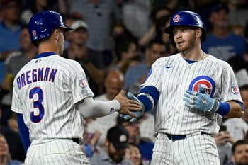 Jun 4, 2026; Chicago, Illinois, USA;  Chicago Cubs left fielder Ian Happ (8) celebrates with third baseman Alex Bregman (3) after hitting a two run home run during the seventh inning against the Oakland Athletics at Wrigley Field. Mandatory Credit: Matt Marton-Imagn Images