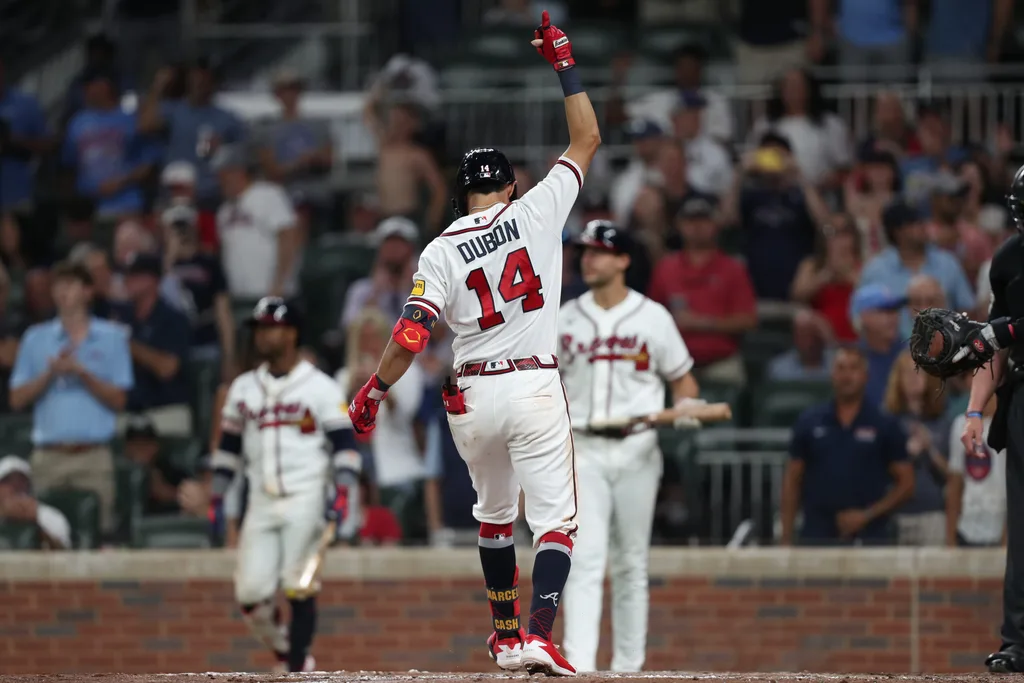 Jun 4, 2026; Cumberland, Georgia, USA; Atlanta Braves shortstop Mauricio Dubón (14) celebrates after hitting a home run against the Toronto Blue Jays in the eighth inning at Truist Park. Mandatory Credit: Mady Mertens-Imagn Images