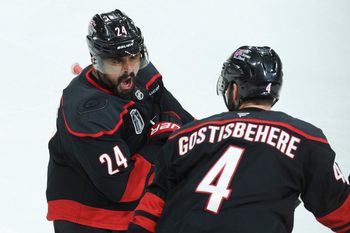 Jun 4, 2026; Raleigh, North Carolina, USA; Carolina Hurricanes right wing Seth Jarvis (24) celebrates scoring in overtime with defenseman Shayne Gostisbehere (4) against the Vegas Golden Knights in game two of the 2026 Stanley Cup Final at Lenovo Center. Mandatory Credit: Nathan Ray Seebeck-Imagn Images