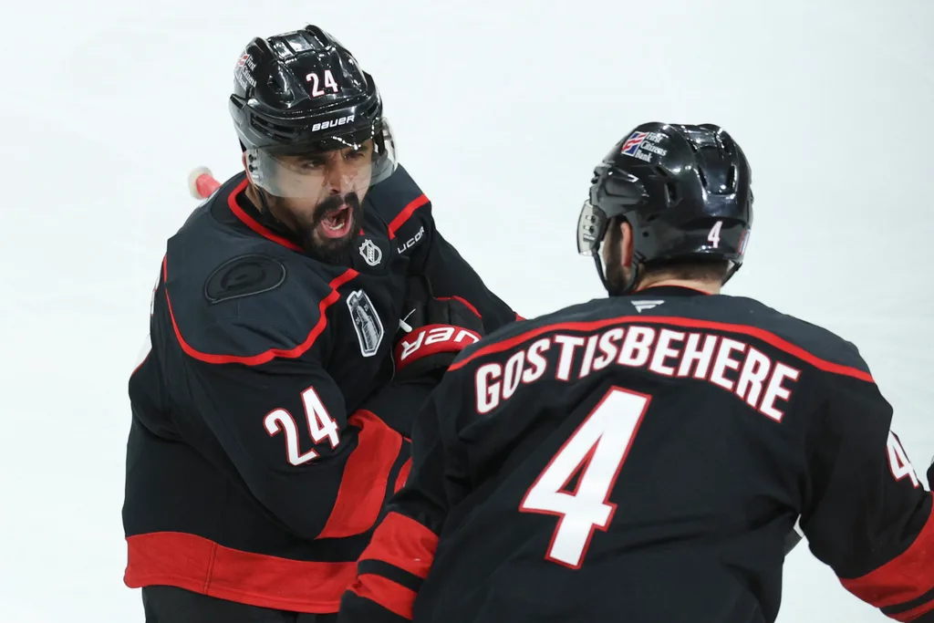 Jun 4, 2026; Raleigh, North Carolina, USA; Carolina Hurricanes right wing Seth Jarvis (24) celebrates scoring in overtime with defenseman Shayne Gostisbehere (4) against the Vegas Golden Knights in game two of the 2026 Stanley Cup Final at Lenovo Center. Mandatory Credit: Nathan Ray Seebeck-Imagn Images