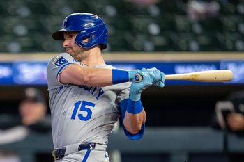 Jun 4, 2026; Minneapolis, Minnesota, USA; Kansas City Royals center fielder Lane Thomas (15) hits a single against the Minnesota Twins in the ninth inning at Target Field. Mandatory Credit: Jesse Johnson-Imagn Images