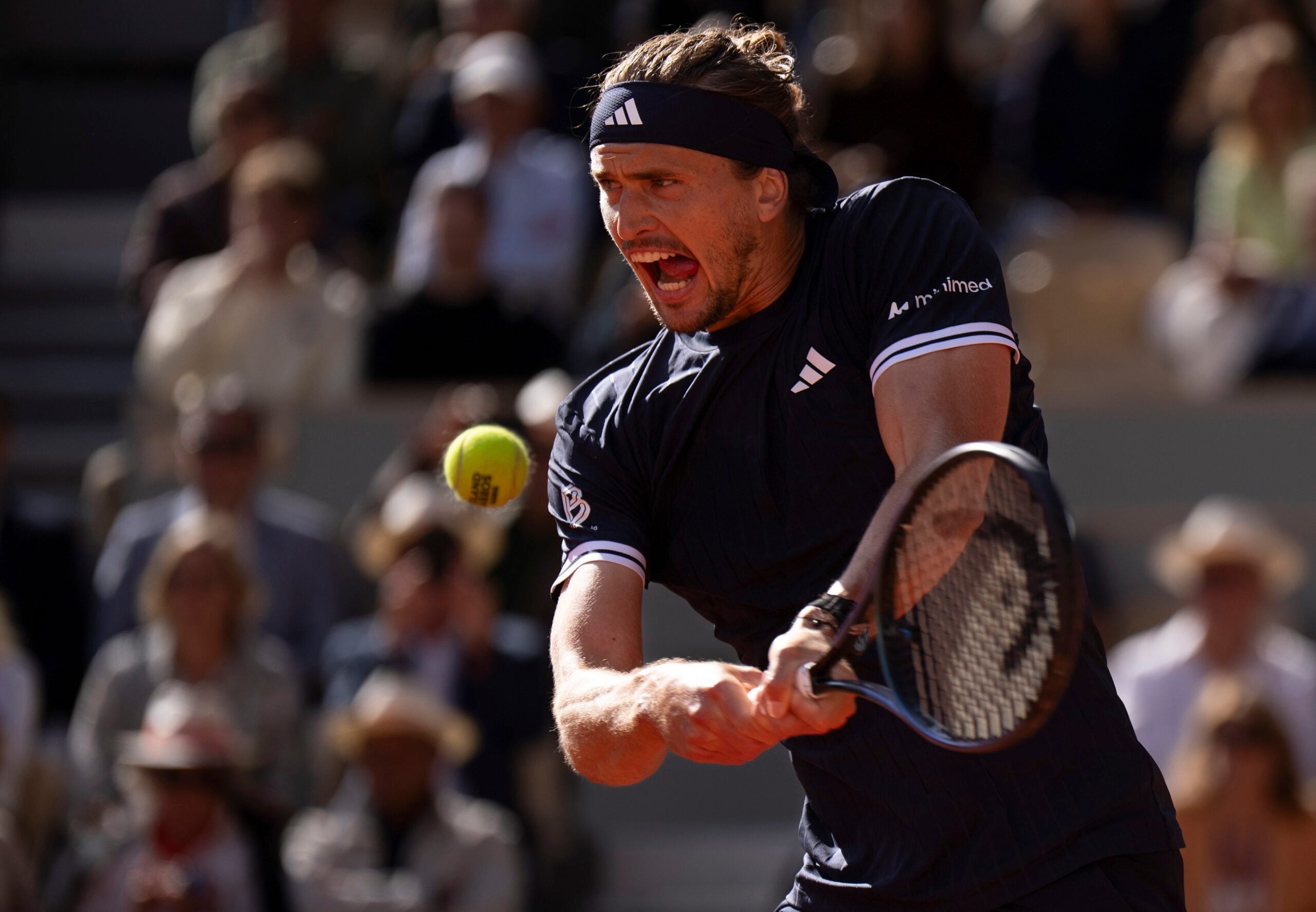 Jun 5, 2026; Paris, France;  Alexander Zverev of Germany returns a shot during his match against Jakub Mensik of Czechia on day 12 at Stade Roland Garros. Mandatory Credit: Susan Mullane-Imagn Images