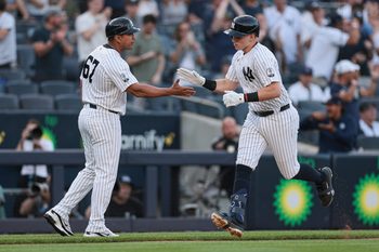 Jun 5, 2026; Bronx, New York, USA; New York Yankees first baseman Ben Rice (22) celebrates with third base/outfield coach Luis Rojas (67) after hitting a solo home run during the first inning against the Boston Red Sox at Yankee Stadium. Mandatory Credit: Vincent Carchietta-Imagn Images