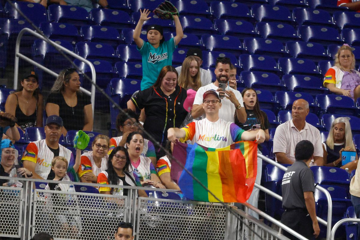 Jun 5, 2026; Miami, Florida, USA;  Fans hold up a Pride Flag and cheer on MLB Pride Night between the Tampa Bay Rays  against the Miami Marlins during the fourth inning at loanDepot Park. Mandatory Credit: Rhona Wise-Imagn Images