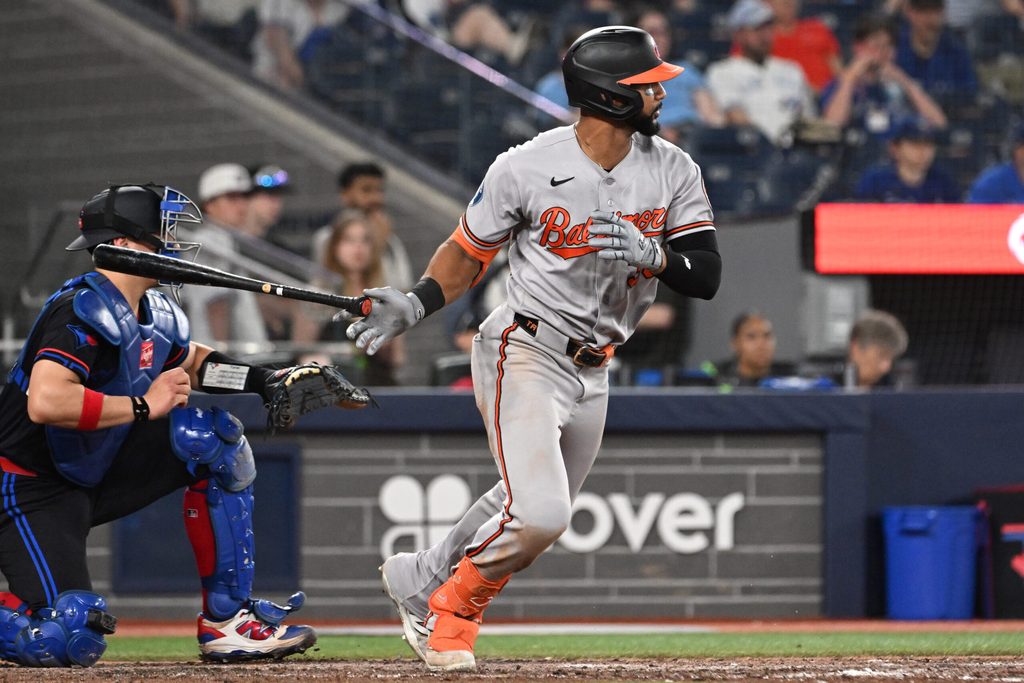 Jun 5, 2026; Toronto, Ontario, CAN; Baltimore Orioles center fielder Leody Taveras (30) hits a ball that creates a Toronto Blue Jays throwing error that scores two runs in the ninth inning at Rogers Centre. Mandatory Credit: Dan Hamilton-Imagn Images