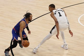 Jun 5, 2026; San Antonio, Texas, USA; New York Knicks guard Jalen Brunson (11) dribbles the ball against San Antonio Spurs forward Victor Wembanyama (1) in the second half during game two of the 2026 NBA Finals at Frost Bank Center. Mandatory Credit: Geoff Burke-Imagn Images