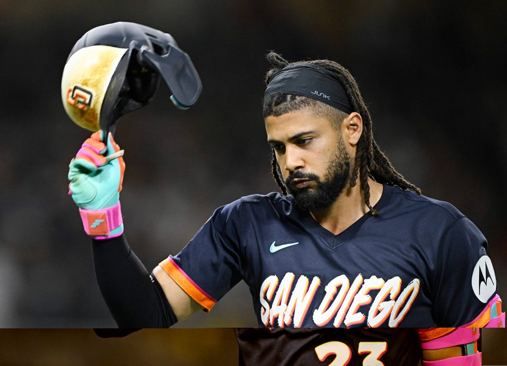Jun 5, 2026; San Diego, California, USA; San Diego Padres right fielder Fernando Tatis Jr. (23) throws his helmet after lining out during the eighth inning against the New York Mets at Petco Park. Mandatory Credit: Denis Poroy-Imagn Images