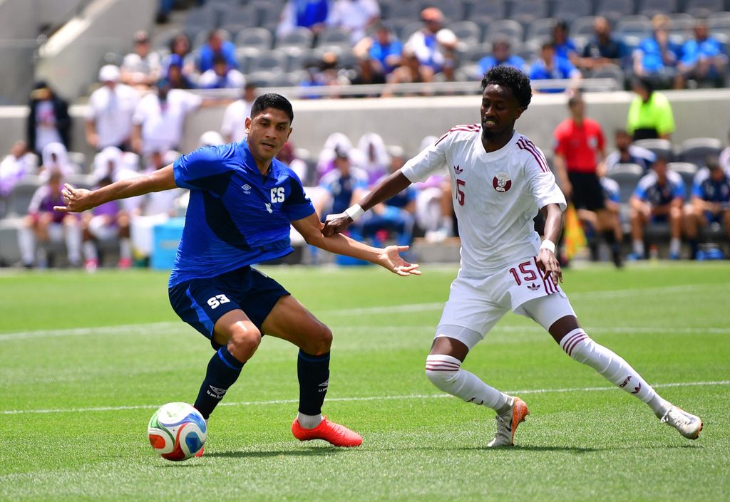 June 6, 2026; Los Angeles, California, U.S.; El Salvador's Christian Martinez in action with Qatar's Yusuf Abdurisag. Mandatory Credit: Gary Vasquez-Imagn Images