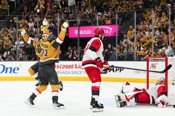 Jun 6, 2026; Las Vegas, Nevada, USA; Vegas Golden Knights right wing Mitch Marner (93) and center William Karlsson (71) celebrate after a goal by defenseman Shea Theodore (not pictured) as Carolina Hurricanes defenseman Alexander Nikishin (21) and goaltender Brandon Bussi (32) react during the second overtime in game three of the 2026 Stanley Cup Final at T-Mobile Arena. Mandatory Credit: Stephen R. Sylvanie-Imagn Images