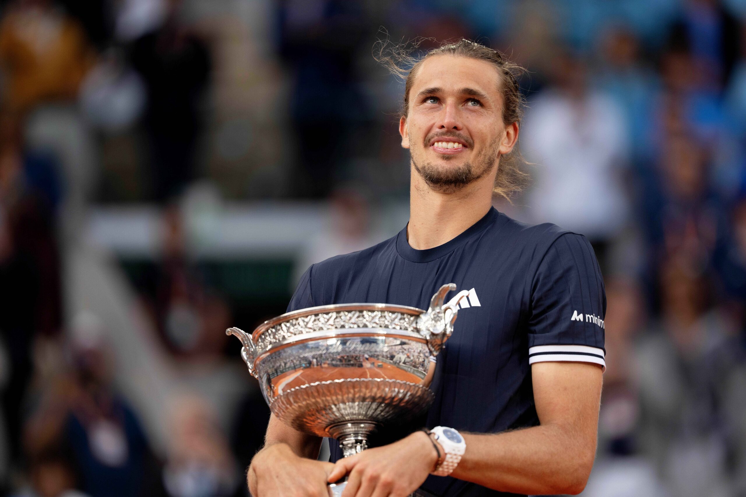 Jun 7, 2026; Paris,  France; Alexander Zverev of Germany poses with the trophy after winning the mens singles final against Flavio Cobolli of Italy on day 15  at Stade Roland Garros. Mandatory Credit: Susan Mullane-Imagn Images