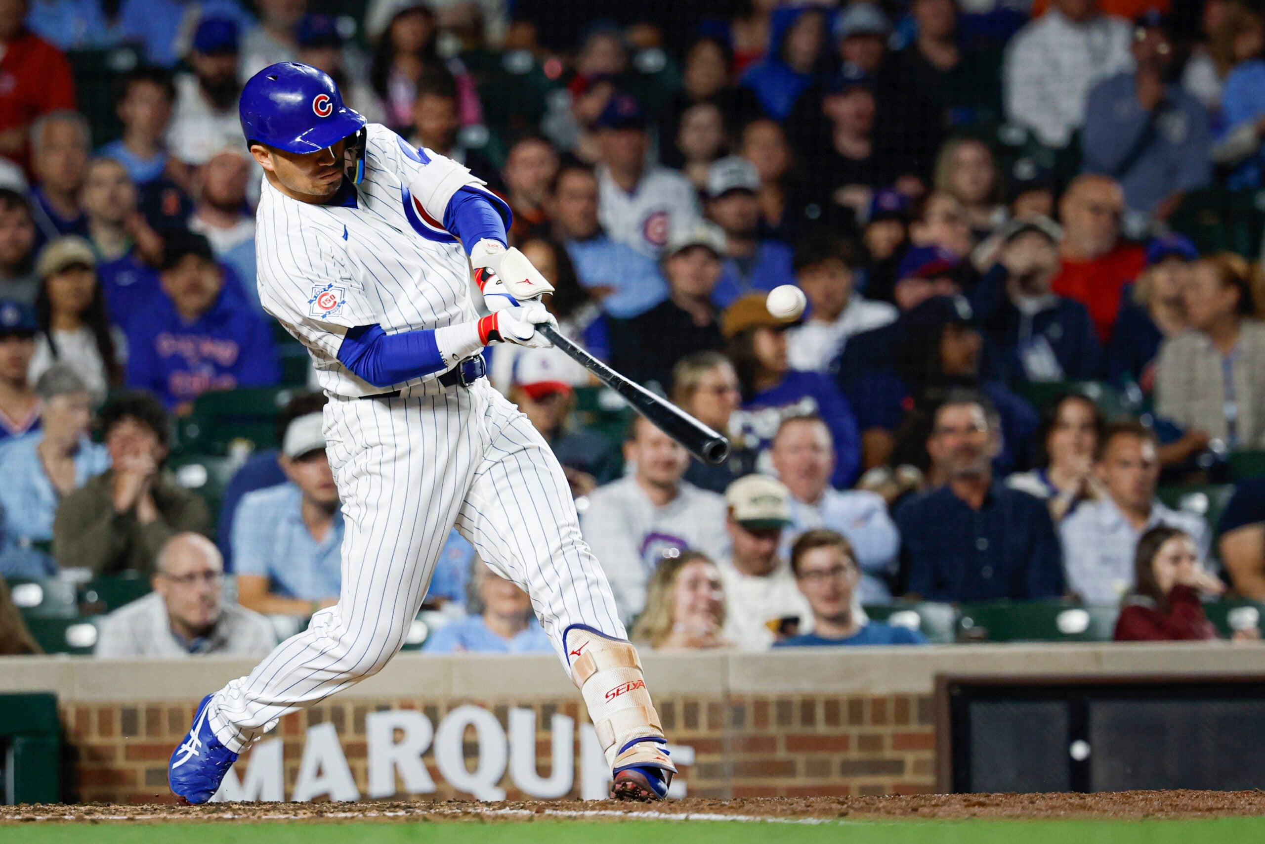 Jun 7, 2026; Chicago, Illinois, USA; Chicago Cubs right fielder Seiya Suzuki (27) singles against the San Francisco Giants during the sixth inning at Wrigley Field. Mandatory Credit: Kamil Krzaczynski-Imagn Images