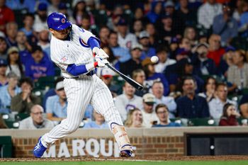 Jun 7, 2026; Chicago, Illinois, USA; Chicago Cubs right fielder Seiya Suzuki (27) singles against the San Francisco Giants during the sixth inning at Wrigley Field. Mandatory Credit: Kamil Krzaczynski-Imagn Images