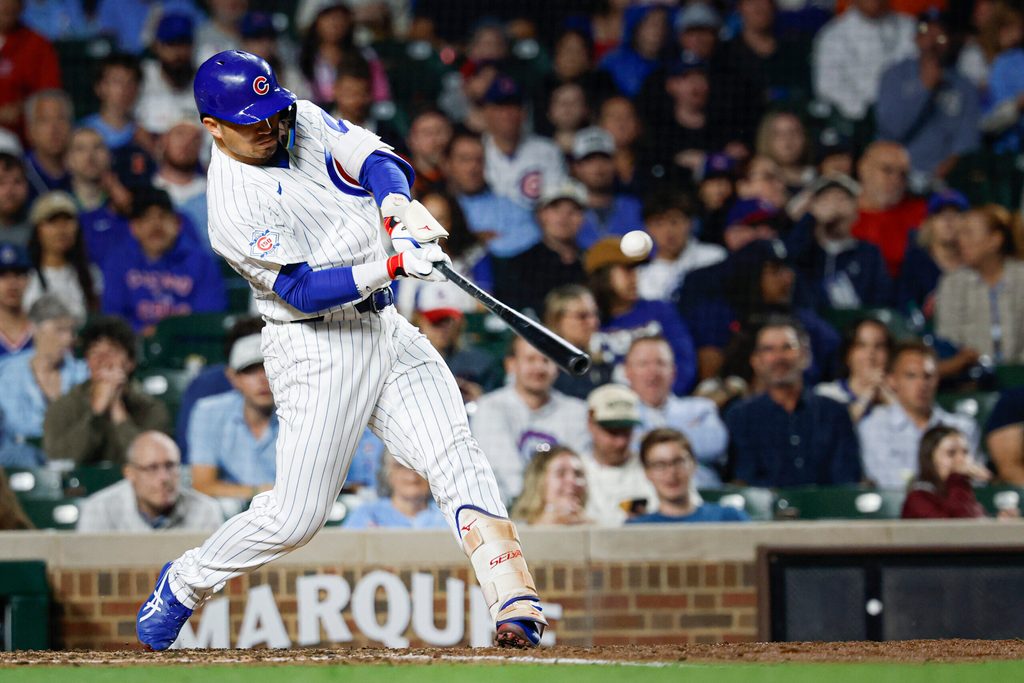 Jun 7, 2026; Chicago, Illinois, USA; Chicago Cubs right fielder Seiya Suzuki (27) singles against the San Francisco Giants during the sixth inning at Wrigley Field. Mandatory Credit: Kamil Krzaczynski-Imagn Images