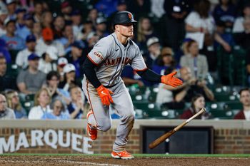 Jun 7, 2026; Chicago, Illinois, USA; San Francisco Giants third baseman Matt Chapman (26) hits an RBI-single against the Chicago Cubs during the 10th inning at Wrigley Field. Mandatory Credit: Kamil Krzaczynski-Imagn Images