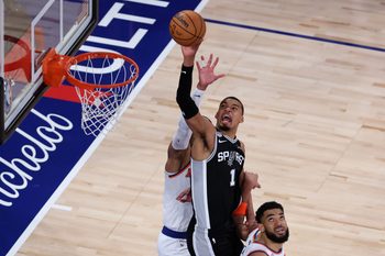 Jun 8, 2026; New York, New York, USA; San Antonio Spurs forward Victor Wembanyama (1) shoots the ball against New York Knicks center Karl-Anthony Towns (32) during game three of the 2026 NBA Finals in the fourth quarter at Madison Square Garden. Mandatory Credit: Wendell Cruz-Imagn Images