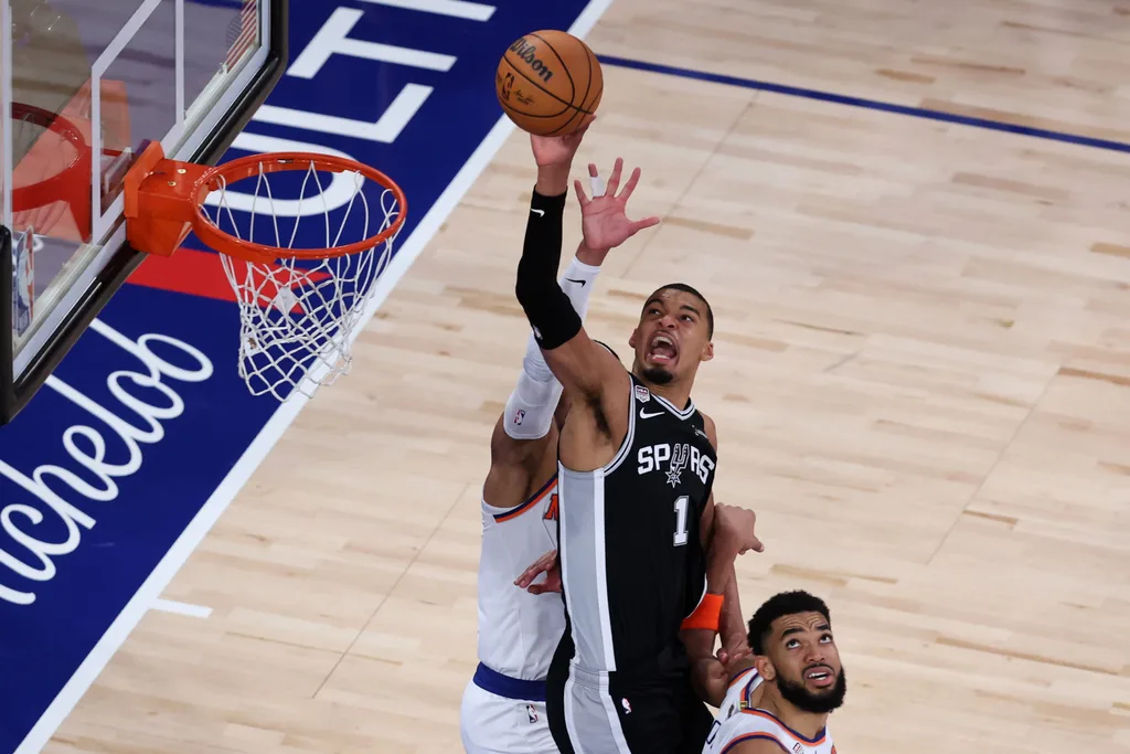 Jun 8, 2026; New York, New York, USA; San Antonio Spurs forward Victor Wembanyama (1) shoots the ball against New York Knicks center Karl-Anthony Towns (32) during game three of the 2026 NBA Finals in the fourth quarter at Madison Square Garden. Mandatory Credit: Wendell Cruz-Imagn Images