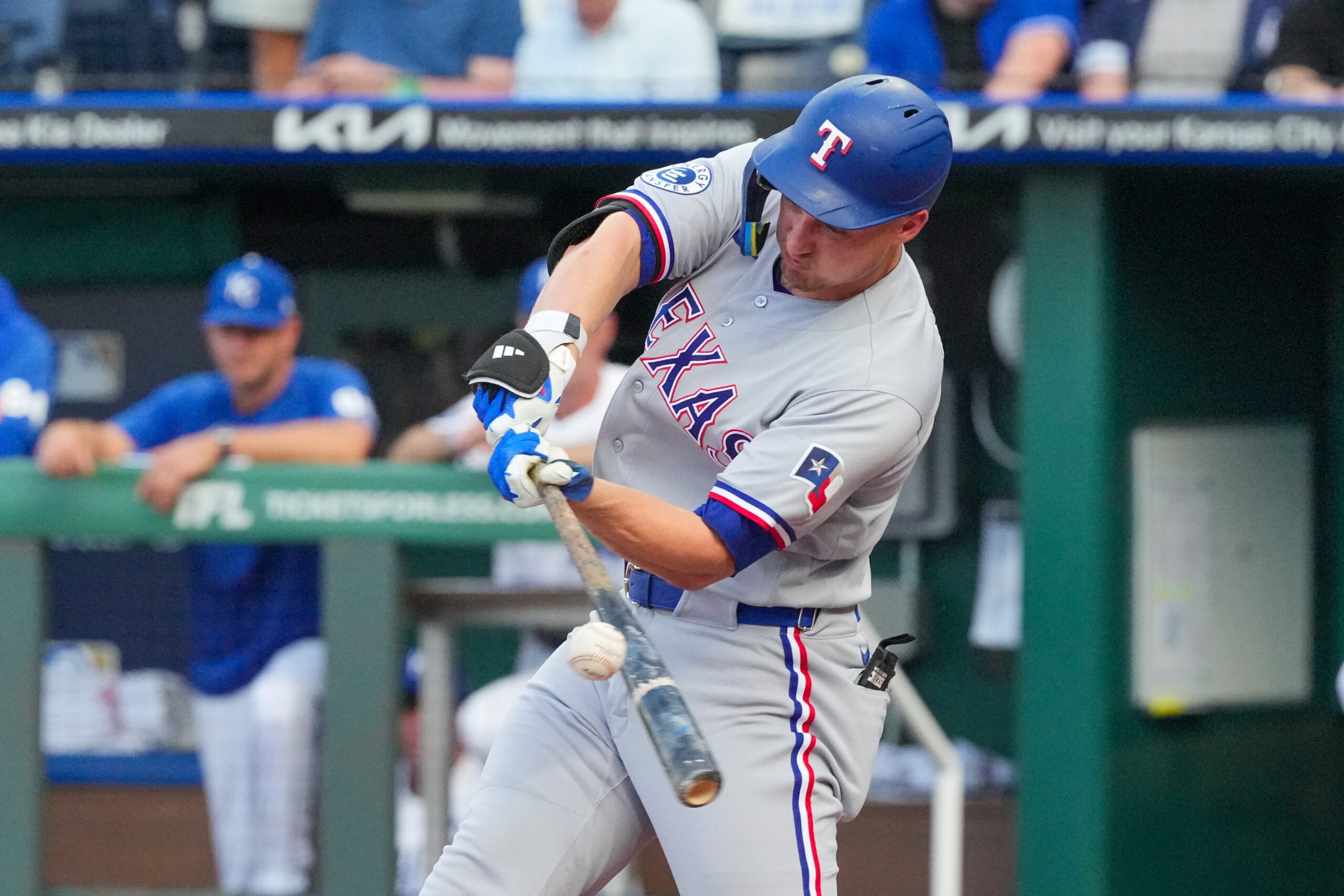 Jun 9, 2026; Kansas City, Missouri, USA; Texas Rangers shortstop Corey Seager (5) hits a single against the Kansas City Royals during the first inning at Kauffman Stadium. Mandatory Credit: Denny Medley-Imagn Images