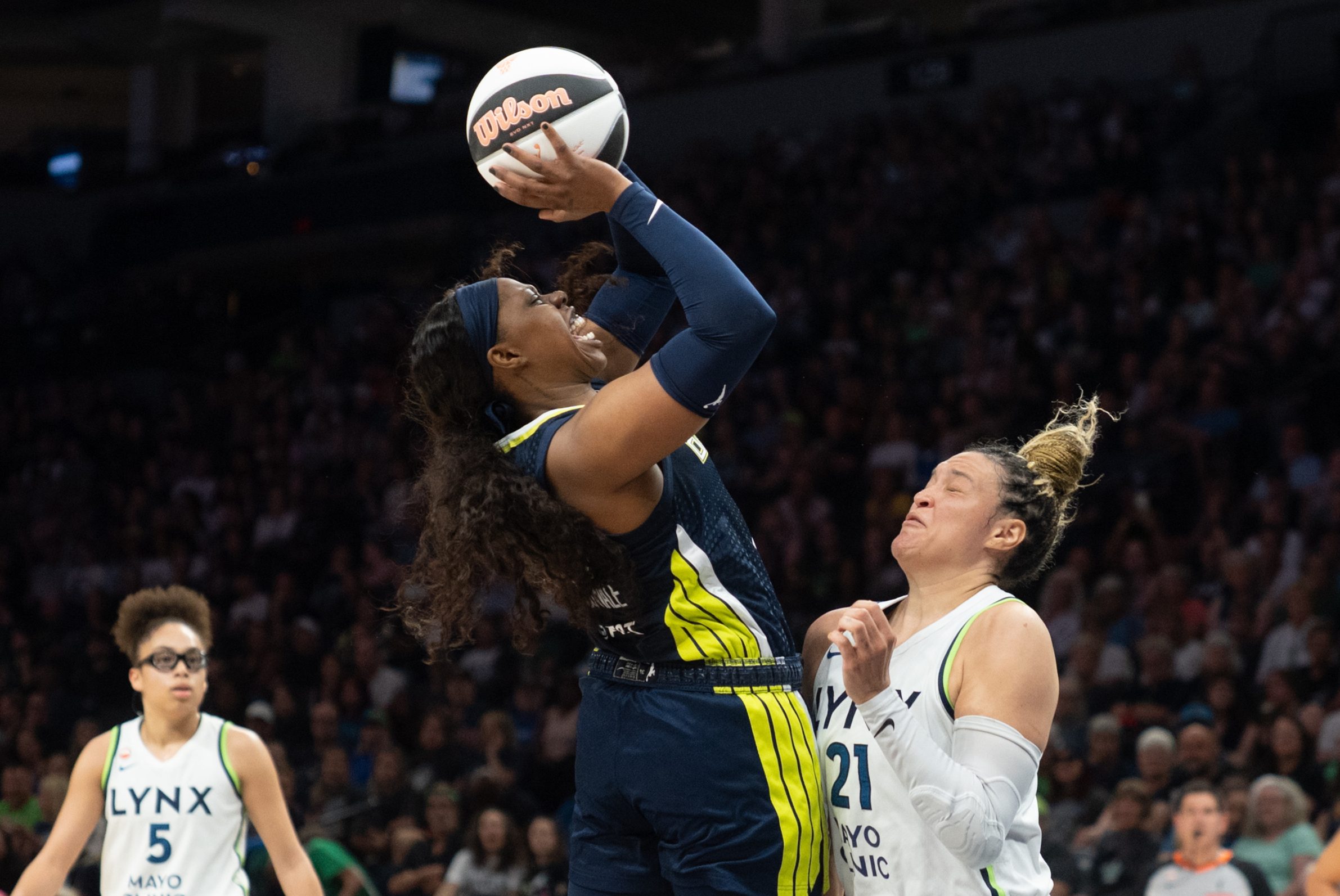 Jun 9, 2026; Minneapolis, Minnesota, USA; Dallas Wings guard Arike Ogunbowale (24) and Minnesota Lynx guard Kayla McBride (21) collide in the second quarter at Target Center. Mandatory Credit: Matt Blewett-Imagn Images