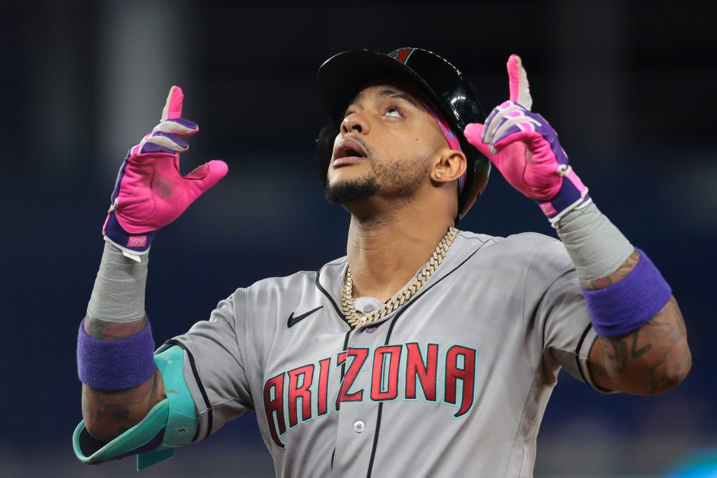 Jun 9, 2026; Miami, Florida, USA; Arizona Diamondbacks second baseman Ketel Marte (4) reacts from first base after hitting a two-run single against the Miami Marlins during the eighth inning at loanDepot Park. Mandatory Credit: Sam Navarro-Imagn Images