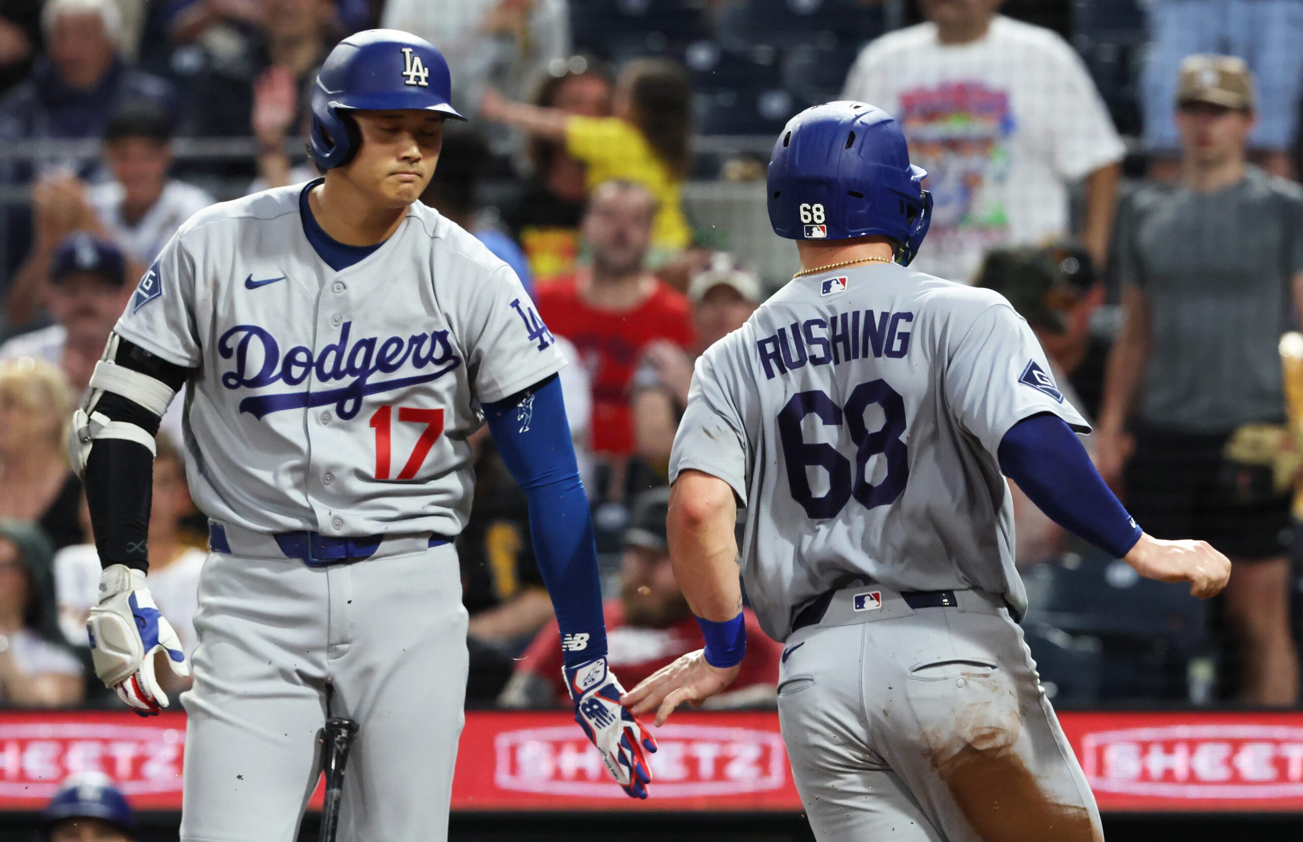 Jun 9, 2026; Pittsburgh, Pennsylvania, USA;  Los Angeles Dodgers designated hitter Shohei Ohtani (17) greets catcher Dalton Rushing (68) crossing home plate to score a run against the Pittsburgh Pirates during the seventh inning at PNC Park. Mandatory Credit: Charles LeClaire-Imagn Images