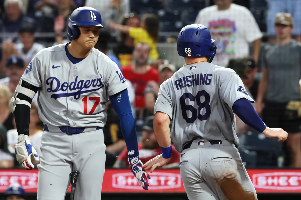 Jun 9, 2026; Pittsburgh, Pennsylvania, USA; Los Angeles Dodgers designated hitter Shohei Ohtani (17) greets catcher Dalton Rushing (68) crossing home plate to score a run against the Pittsburgh Pirates during the seventh inning at PNC Park. Mandatory Credit: Charles LeClaire-Imagn Images