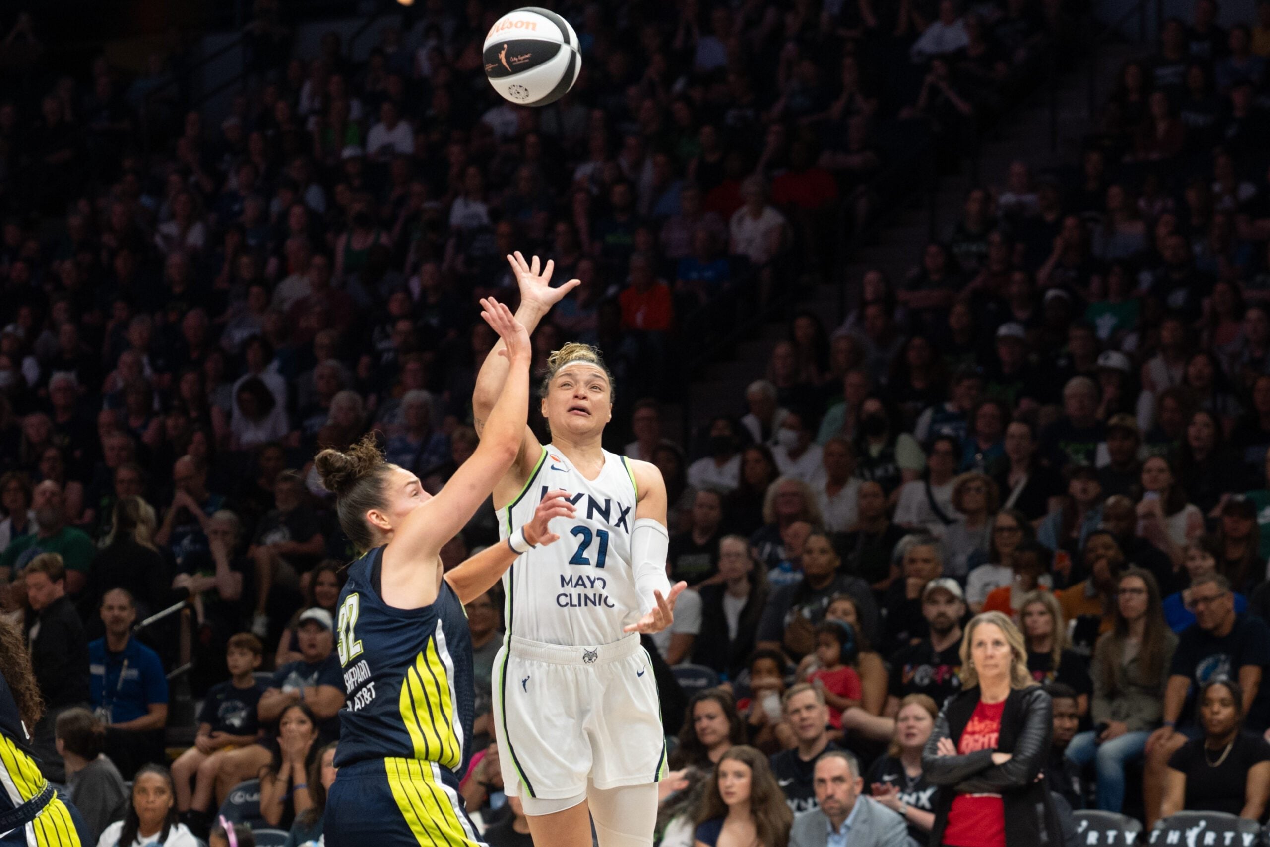 Jun 9, 2026; Minneapolis, Minnesota, USA; Minnesota Lynx guard Kayla McBride (21) shoots a floater over Dallas Wings forward Jessica Shepard (32) in the third quarter at Target Center. Mandatory Credit: Matt Blewett-Imagn Images