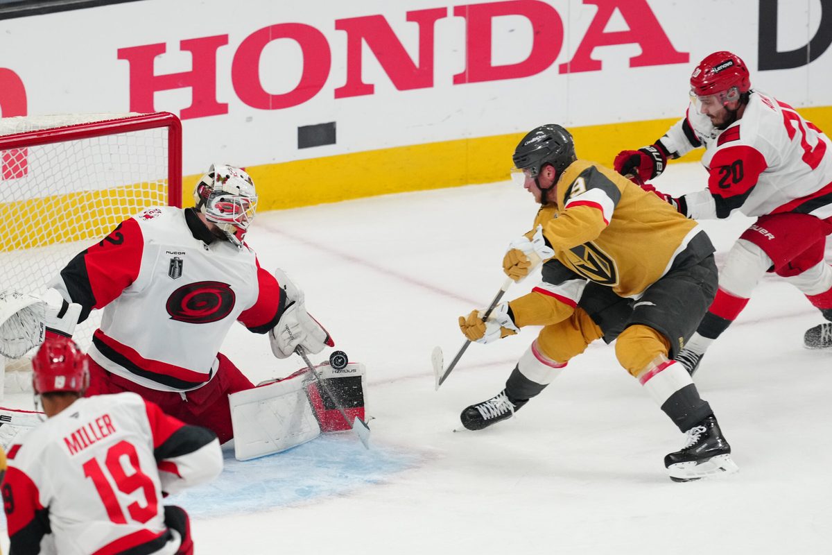 Jun 9, 2026; Las Vegas, Nevada, USA; Carolina Hurricanes goaltender Brandon Bussi (32) stops a shot by Vegas Golden Knights center Jack Eichel (9) during the 3rd period in game four of the 2026 Stanley Cup Final at T-Mobile Arena. Mandatory Credit: Stephen R. Sylvanie-Imagn Images
