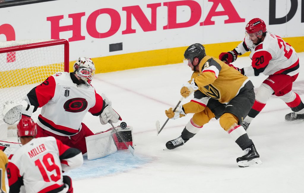 Jun 9, 2026; Las Vegas, Nevada, USA; Carolina Hurricanes goaltender Brandon Bussi (32) stops a shot by Vegas Golden Knights center Jack Eichel (9) during the 3rd period in game four of the 2026 Stanley Cup Final at T-Mobile Arena. Mandatory Credit: Stephen R. Sylvanie-Imagn Images
