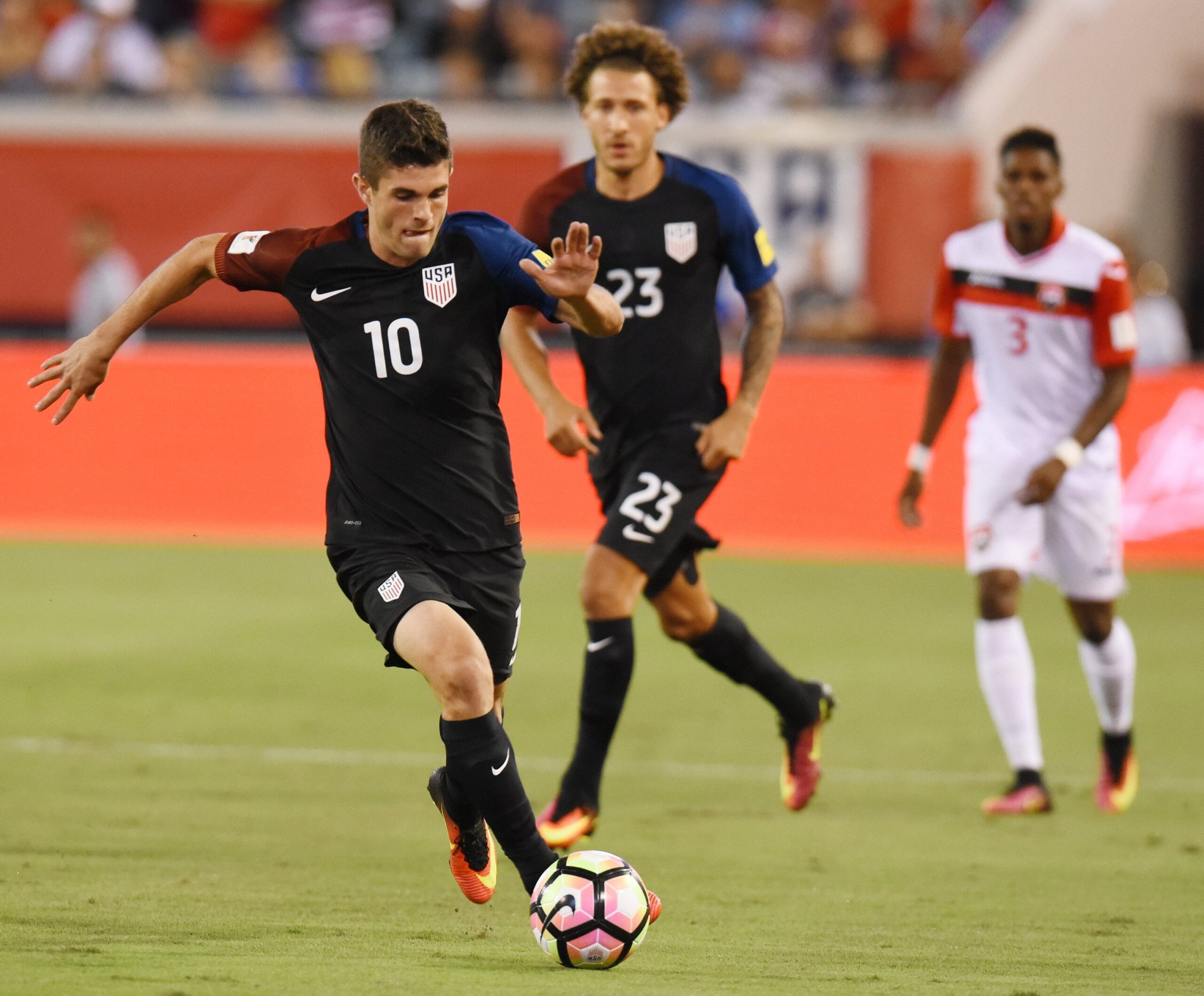 United States midfielder Christian Pulisic (10) moves the ball down the field during early game action against Trinidad & Tobago on September 6, 2016 in a semifinal CONCACAF World Cup qualifier at EverBank Field in Jacksonville, Florida. [Bob Self/Florida Times-Union]