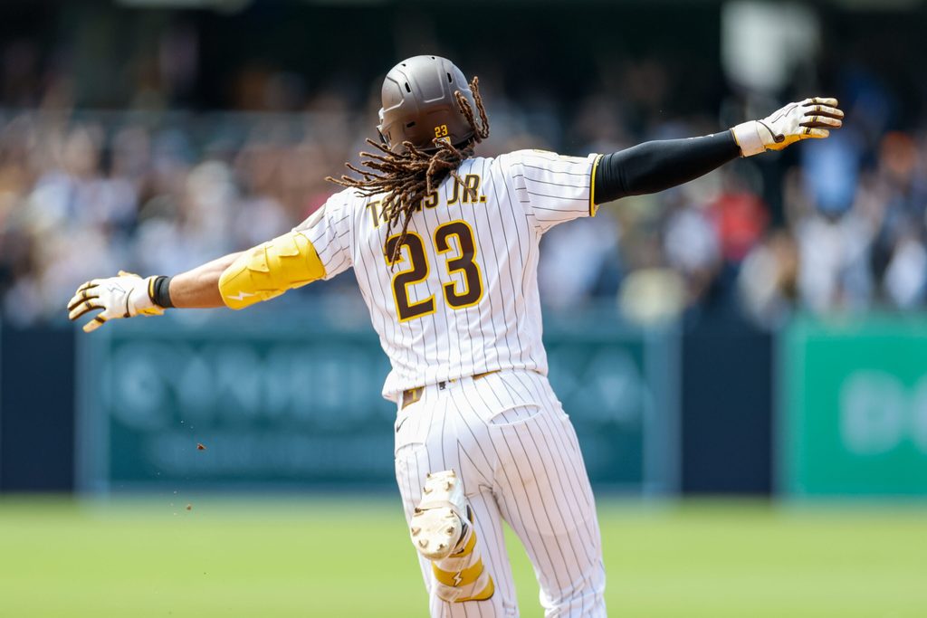 Jun 10, 2026; San Diego, California, USA; San Diego Padres second baseman Fernando Tatis Jr. (23) celebrates after hitting a one run home run during the ninth inning against the Cincinnati Reds at Petco Park. Mandatory Credit: David Frerker-Imagn Images