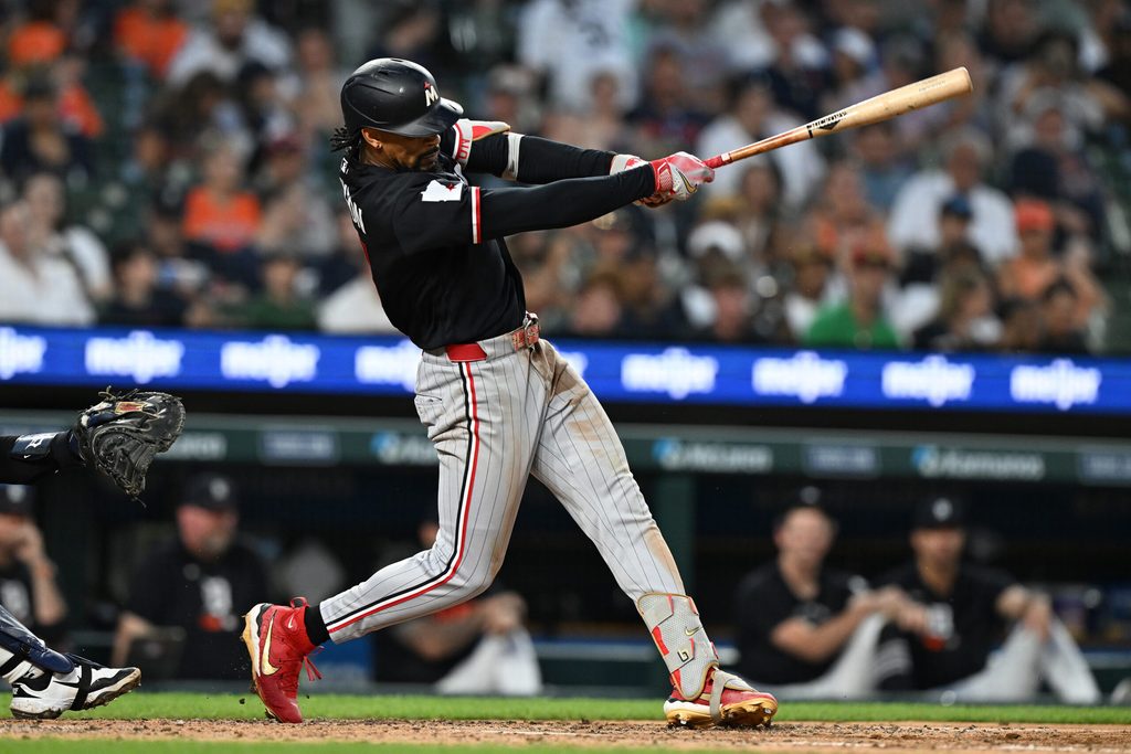 Jun 10, 2026; Detroit, Michigan, USA; Minnesota Twins center fielder Byron Buxton (25) hits a three-run home run against the Detroit Tigers in the fifth inning at Comerica Park. Mandatory Credit: Lon Horwedel-Imagn Images