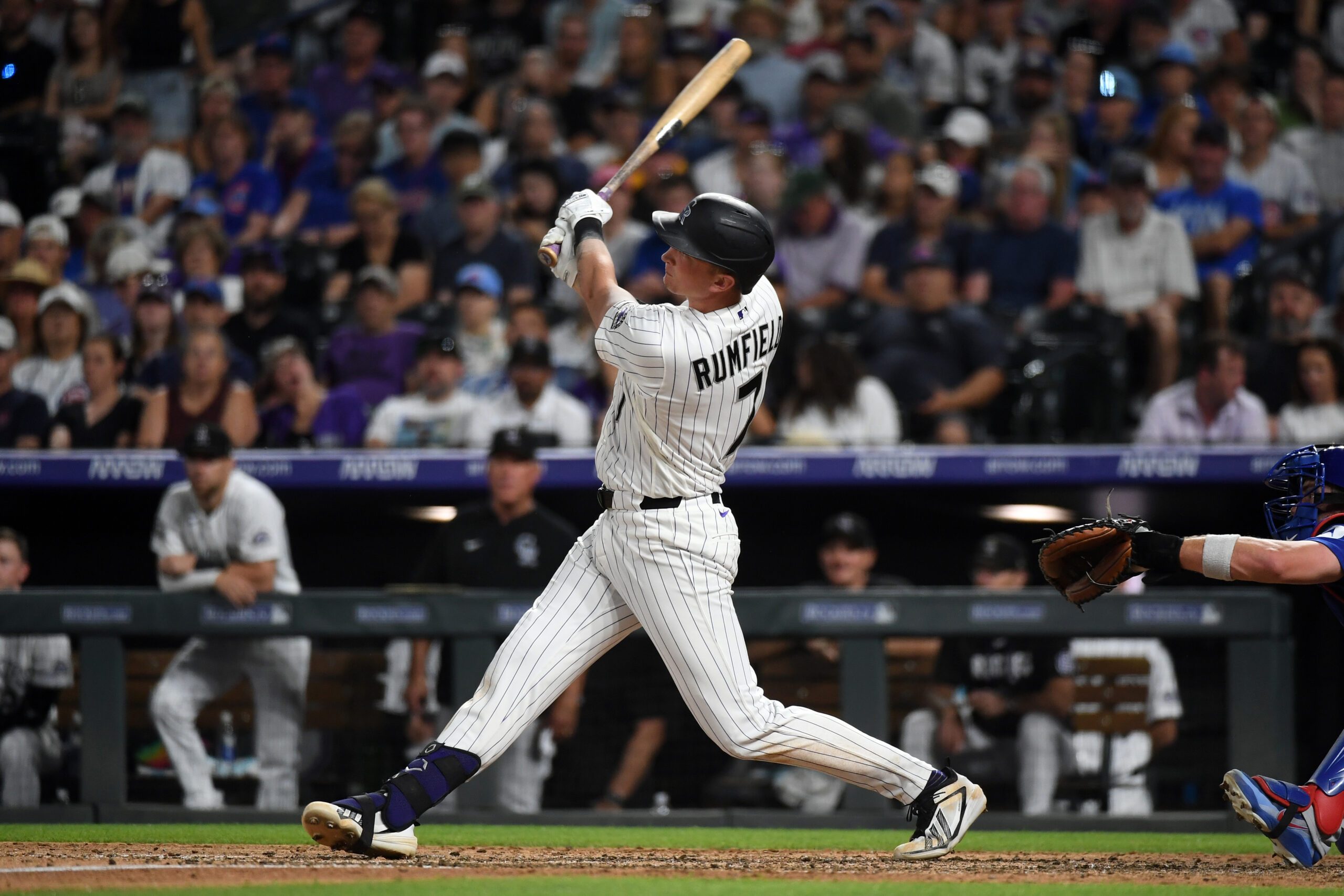 Jun 10, 2026; Denver, Colorado, USA; Colorado Rockies infielder TJ Rumfield (7) hits a home run to take the lead in the eighth inning against the Chicago Cubs at Coors Field. Mandatory Credit: Christopher Hanewinckel-Imagn Images