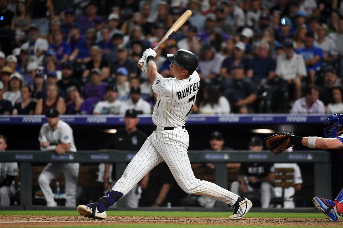 Jun 10, 2026; Denver, Colorado, USA; Colorado Rockies infielder TJ Rumfield (7) hits a home run to take the lead in the eighth inning against the Chicago Cubs at Coors Field. Mandatory Credit: Christopher Hanewinckel-Imagn Images