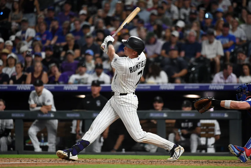 Jun 10, 2026; Denver, Colorado, USA; Colorado Rockies infielder TJ Rumfield (7) hits a home run to take the lead in the eighth inning against the Chicago Cubs at Coors Field. Mandatory Credit: Christopher Hanewinckel-Imagn Images