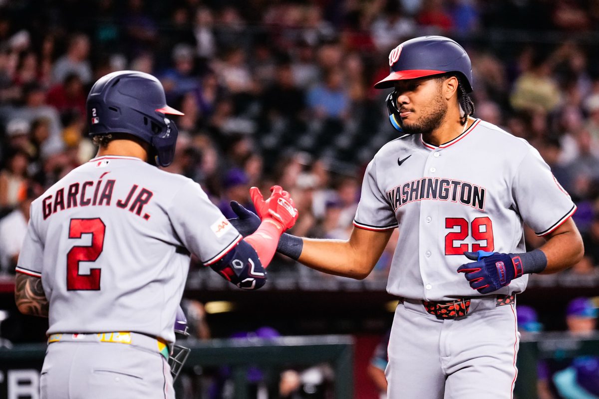 Jun 5, 2026; Phoenix, Arizona, USA; Washington Nationals right fielder James Wood (29) celebrates his solo home run with Luis García Jr. (2) during the third inning at Chase Field. Mandatory Credit: Arianna Grainey-Imagn Images