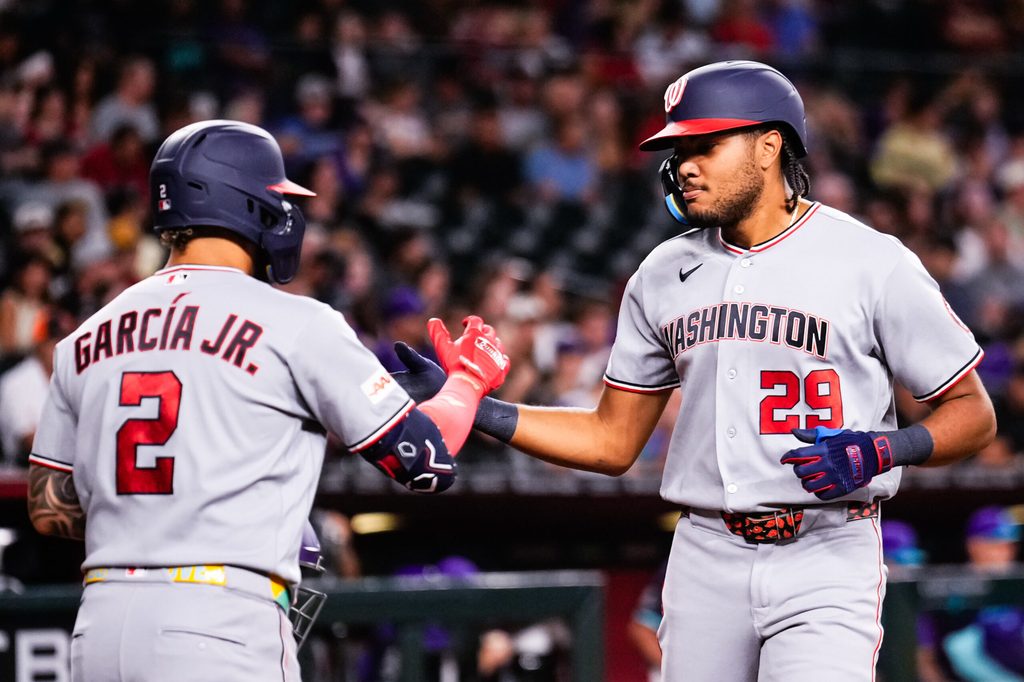 Jun 5, 2026; Phoenix, Arizona, USA; Washington Nationals right fielder James Wood (29) celebrates his solo home run with Luis García Jr. (2) during the third inning at Chase Field. Mandatory Credit: Arianna Grainey-Imagn Images