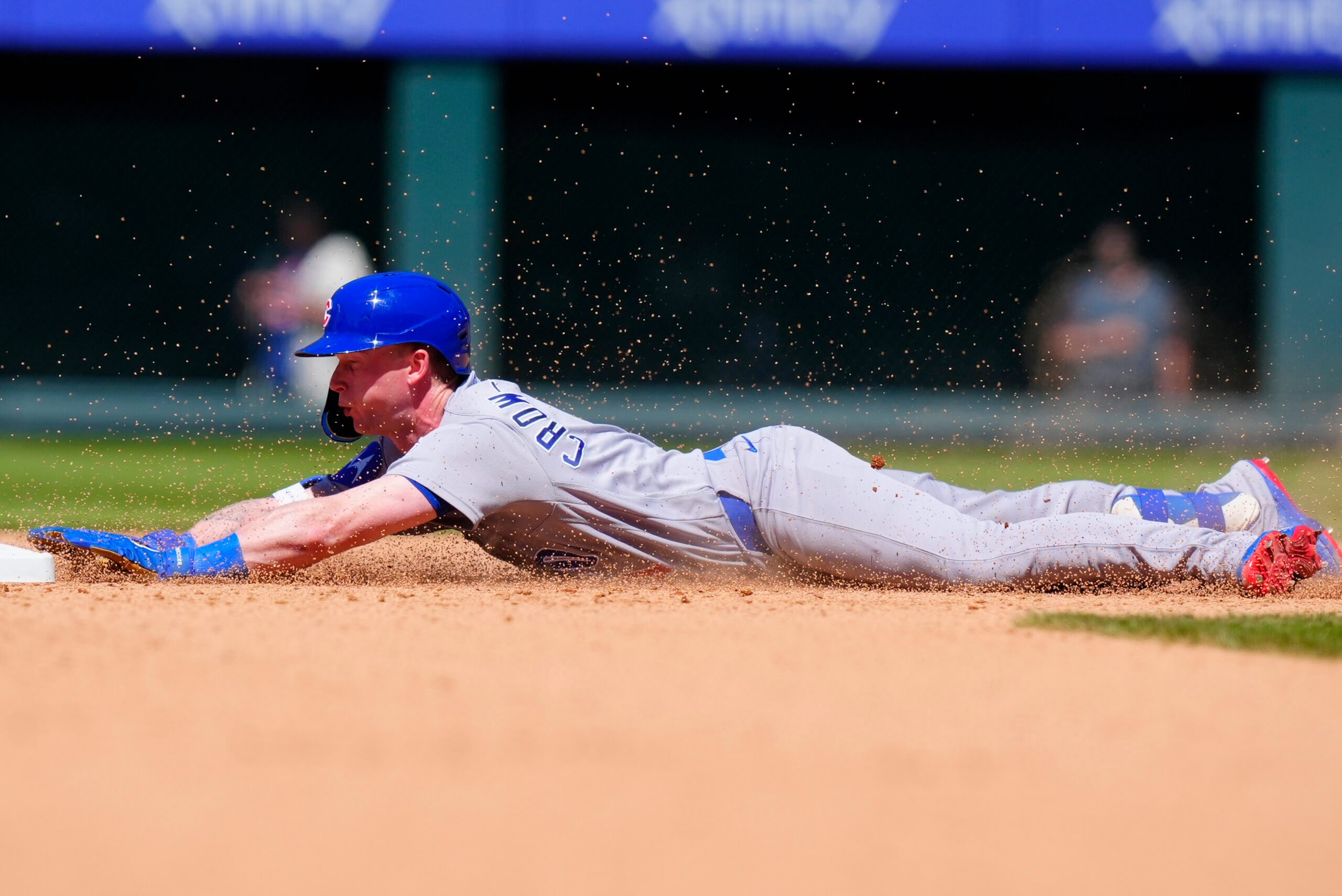 Jun 11, 2026; Denver, Colorado, USA;  Chicago Cubs center fielder Pete Crow-Armstrong (4) slides into second base in the seventh inning against the Colorado Rockies at Coors Field. Mandatory Credit: Ron Chenoy-Imagn Images